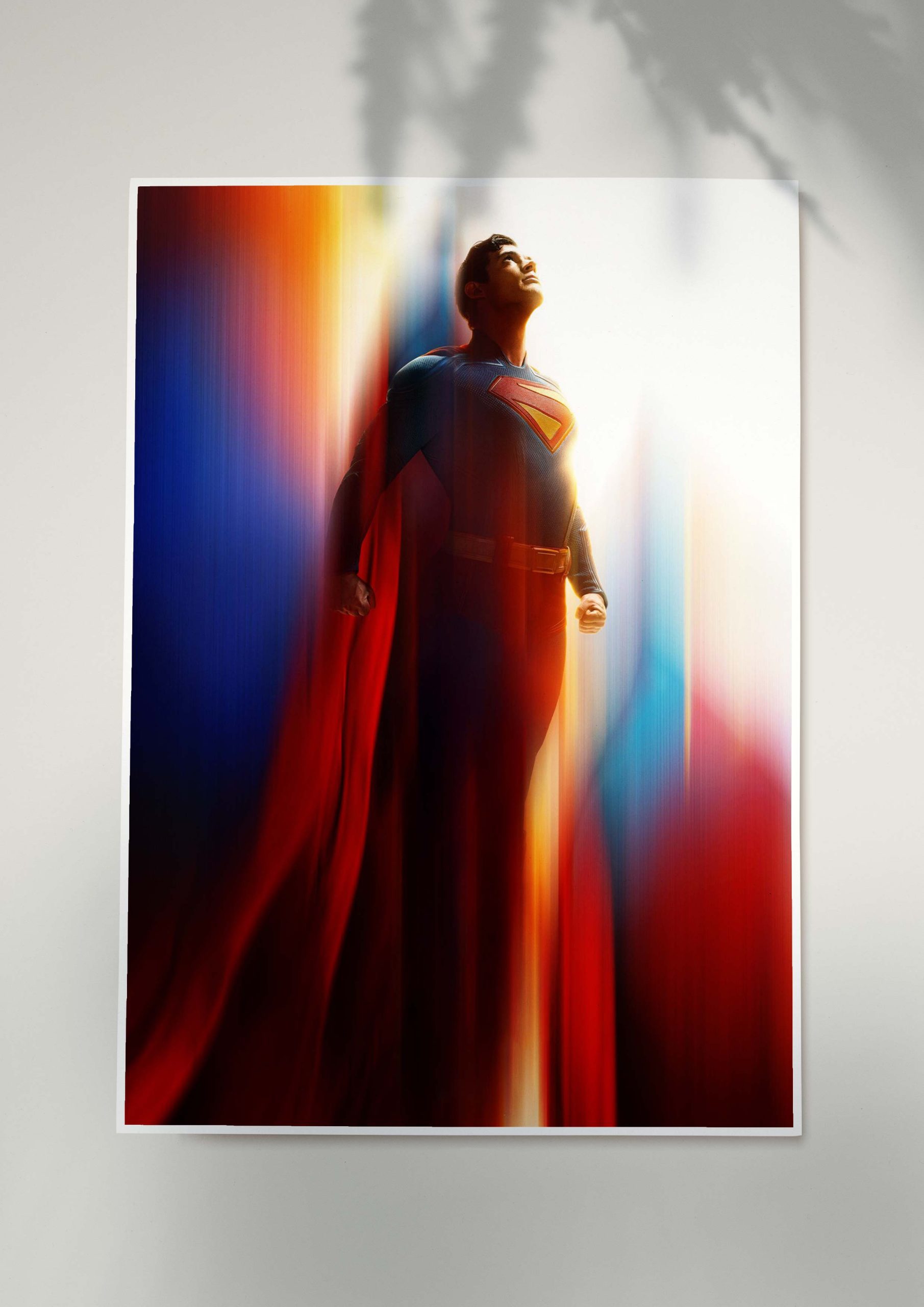 Superman rising into light in cinematic superhero poster